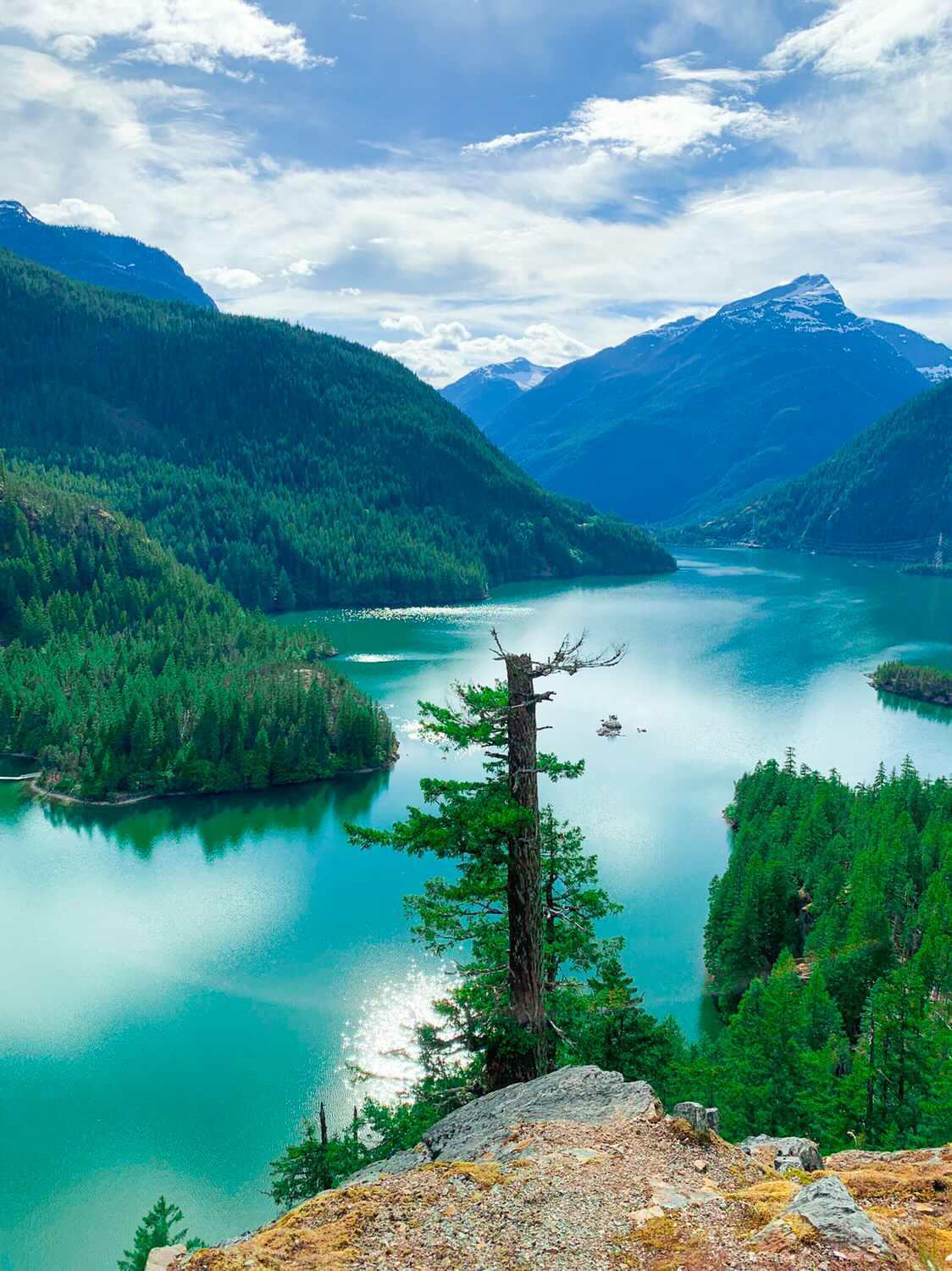 Diablo Lake glowing turquoise between forested ridges in the North Cascades
