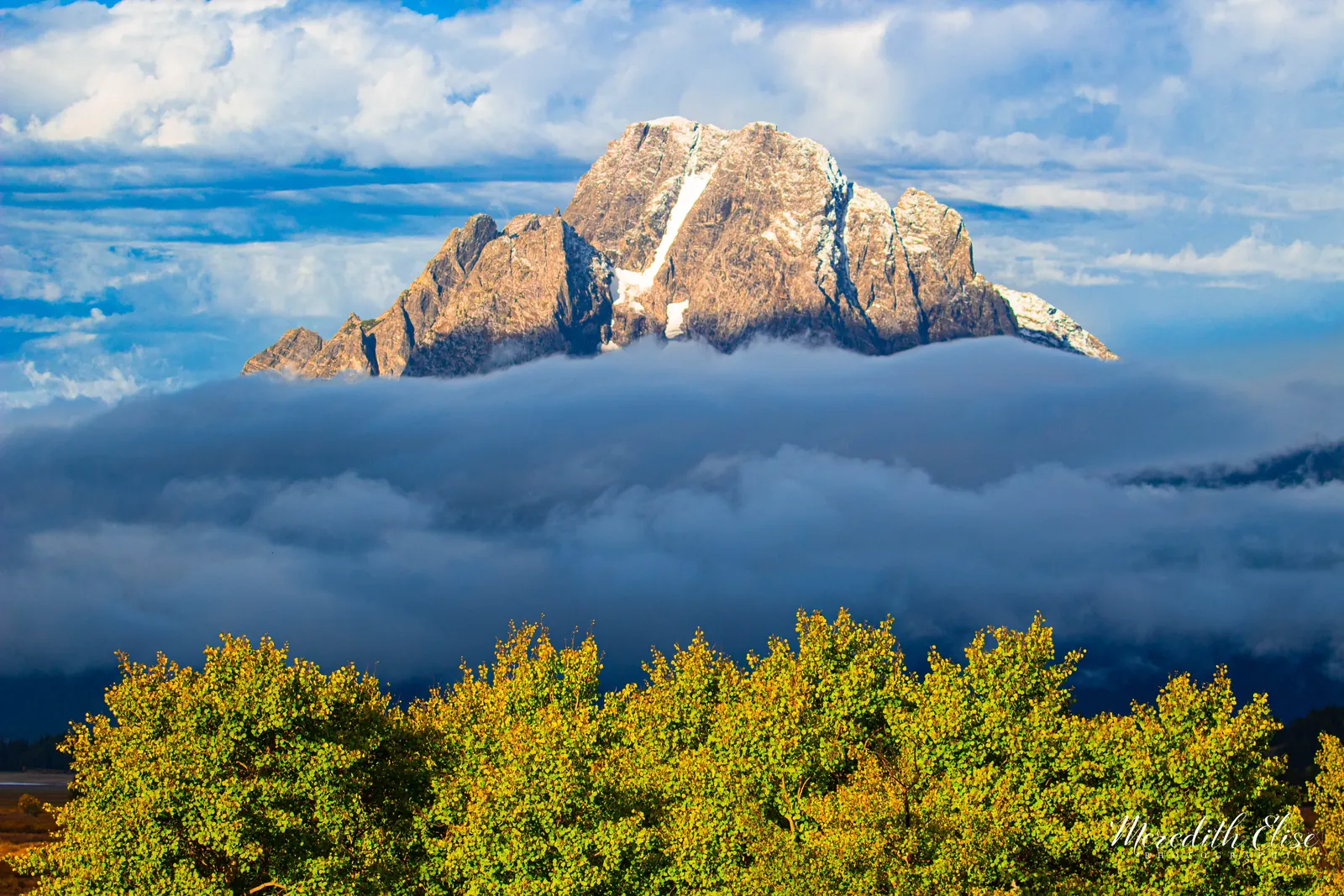 Mount Moran emerging above a sea of clouds with golden aspens below — Grand Teton National Park Wyoming fine art print